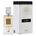 A bottle of Ana Abiyedh Eau de Parfum next to its white and black packaging box with gold accents, on a plain white background.