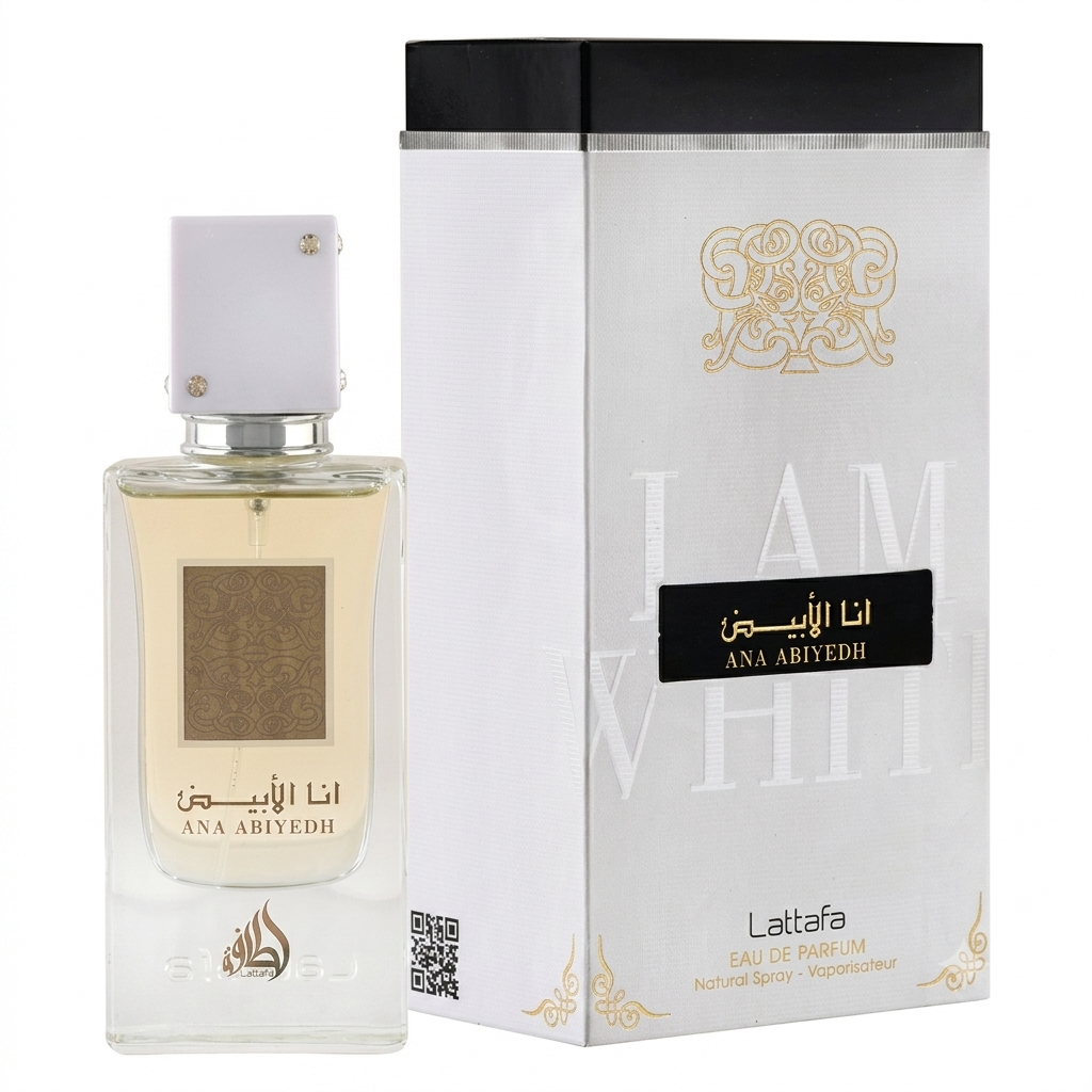 A bottle of Ana Abiyedh Eau de Parfum next to its white and black packaging box with gold accents, on a plain white background.