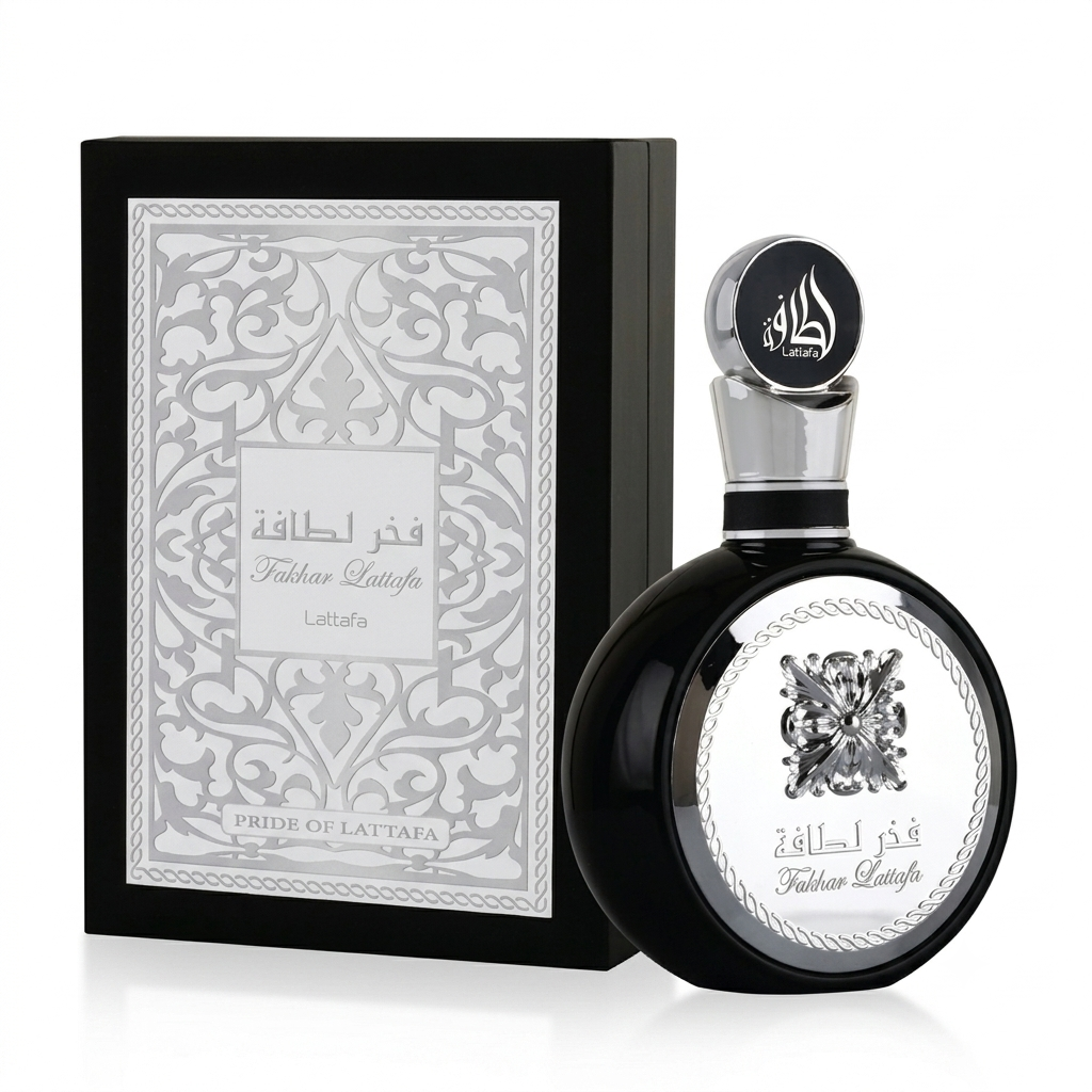 A bottle of Lattafa Fakhra Alahafa perfume next to its black presentation box, both featuring silver Arabic calligraphy and ornate patterns on a white background.
