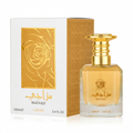 Mazaji Lattafa perfume bottle and its white and gold packaging box, featuring a rose design and gold Arabic lettering.