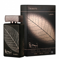Najdia Tribute Lattafa Eau de Parfum bottle and its retail packaging box, both featuring a black background with a detailed beige leaf vein pattern.